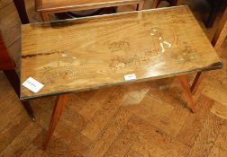 A rectangular top coffee table with inlaid pattern of shepherd with sheep with plate glass top,