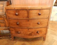 Georgian mahogany bowfront chest of two short and two long graduated drawers, with wooden handles,