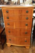 A modern yewwood veneer bow front chest of five long graduated drawers on bracket feet,