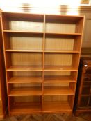 Modern hardwood bookcase of twelve open shelves,