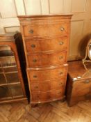 Reproduction mahogany bowfront chest of six graduated drawers, on bracket feet,
