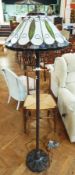 Tiffany style standard lamp on molded metal stand