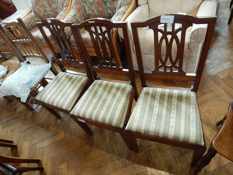 A set of three Edwardian mahogany single chairs, with pierced splat backs,