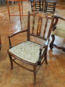 A late Victorian mahogany inlaid open armchair, floral inlays of ivory and satinwood, splat back,