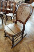 19th century beech frame rocking chair with cane panelled back, solid seat,