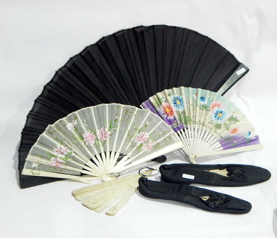 Ebony and gauze black fan and three others together with a pair of black gros grain slippers