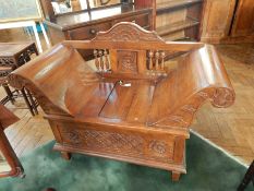 A French hardwood saltbox seat with spindle back, splayed arms,