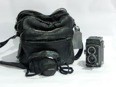 Pentax SLR camera with lenses, tripod,