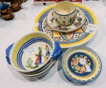 Pair Quimper pottery two-handled bowls, figure painted, Quimper pottery cup and saucer,