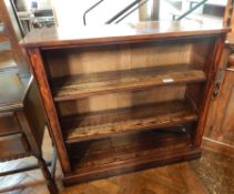 William IV mahogany open bookcase of three shelves, with moulded pillars raised on a plinth base,