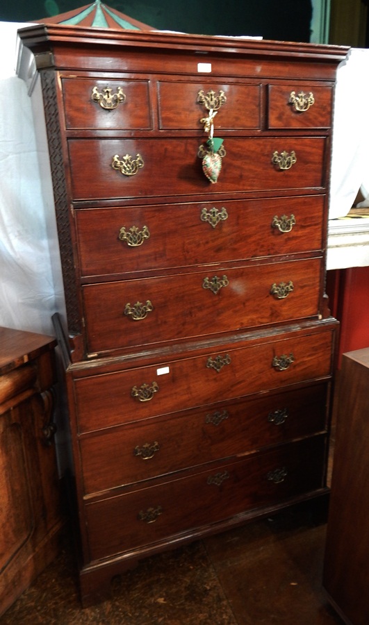 A Georgian mahogany chest on chest with straight moulded pediment,