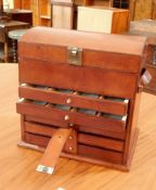 Modern leather jewellery case with opening top section and five long graduated drawers,