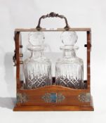 Stained wood silver plate mounted Tantalus with moulded glass rectangular decanters