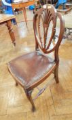 A pair of Hepplewhite style mahogany dining chairs,