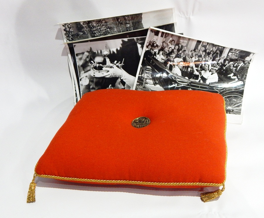 Orange wool foam seat pad with gold braid and tassels and inset Prince of Wales medallion,