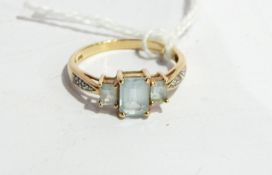 Blue and white stone dress ring set three aquamarine-coloured stones