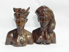 Pair of Eastern carved wood busts of women in elaborate headress',