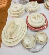 A Royal Doulton "Fairfield" pattern pottery part dinner service with three graduated oval meat