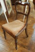 An early Victorian rosewood balloon back dining chair with upholstered drop-in seat,