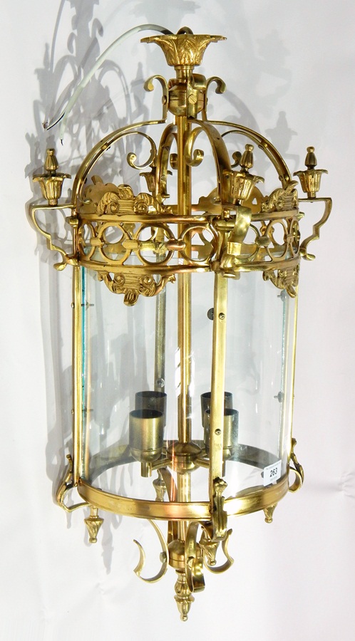 Decorative gilt metal four-light hanging lantern of circular form, having four glass panels,