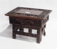 Chinese carved hardwood folding stool table with ornate dragon carving to the top and Oriental