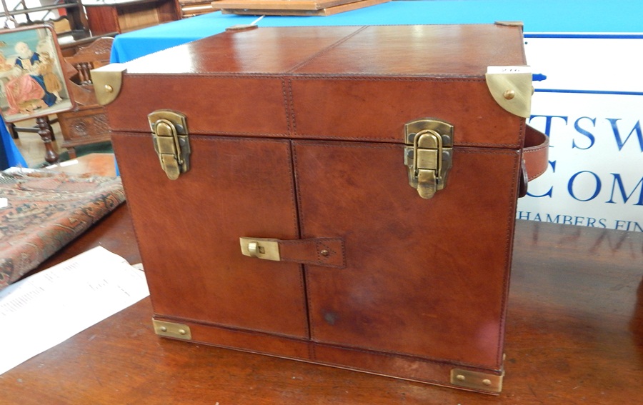 A travelling leather drinks case,