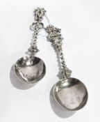 Two continental silver spoons with spiral handles and figure finials,