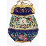 Victorian beadwork gilt metal evening bag with ornate chased floral and scroll mount,