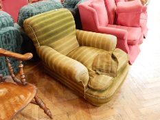 A Victorian armchair with green upholstery,