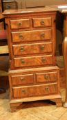 A modern mahogany miniature tallboy of two short and three long drawers in the upper section and