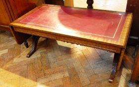 Reproduction mahogany dropflap coffee table, with insert leather top,