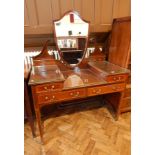 An Edwardian Sheraton style mahogany and satinwood inlaid shield back mirror dressing table,