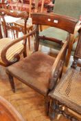 An oak dining chair on tapering reeded supports