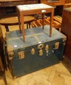 An old cabin trunk with brass mounts,