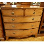 An early 19th century bow front chest with reeded edge top,