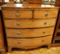 An early 19th century bow front chest with reeded edge top,