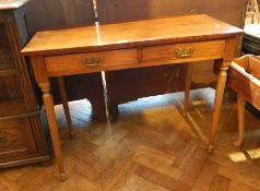 A Georgian style mahogany rectangular top side table with a pair of baize lined frieze drawers on