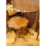 A mahogany circular tilt top side table with turned baluster column and splayed legs together with