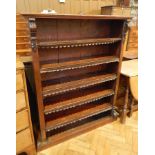 A Victorian mahogany open bookcase with moulded edge top, carved scrollwork mouldings, five shelves,