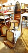 A white painted oval cheval mirror, a circular top mahogany wine table,