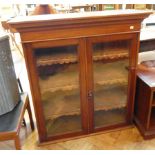 19th century mahogany glazed bookcase, the pair of glass panel doors enclosing three shelves,