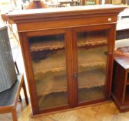 19th century mahogany glazed bookcase, the pair of glass panel doors enclosing three shelves,