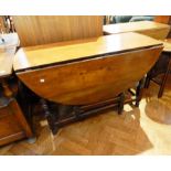 An 18th century fruitwood gateleg table, with oval top,