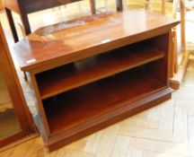 A modern mahogany corner unit with open shelf,