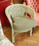 A cane back chair with cushion