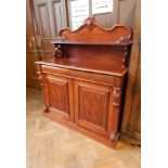 A Victorian mahogany chiffoniere with open shelf back with scrollwork supports,