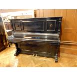 An early 20th century black lacquered upright piano forte by Krautz Berlin, iron frame no.