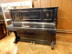 An early 20th century black lacquered upright piano forte by Krautz Berlin, iron frame no.