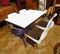 A contemporary white rectangular top dining table with narrow black frieze on square chrome legs,