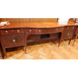 A Georgian style mahogany bowfront sideboard, the centre section with two frieze drawers,